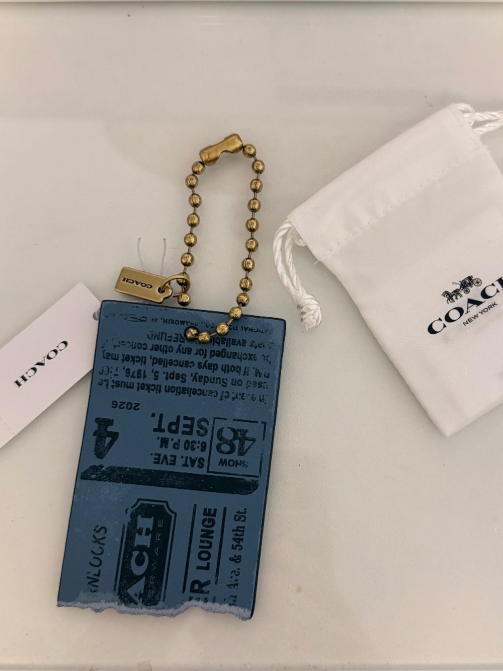 Coach ticket hangtag charm